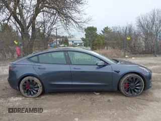 2023 Tesla Model 3 Performance with VIN 5YJ3E1EC9PF407365, listed as a IAAI auction lot 41956915 with 31,087 mi miles. Bid and sale history available at carsss.com. Image 13.