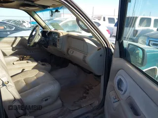 1997 GMC Yukon with VIN 1GKEK13R1VJ723409, listed as a IAAI auction lot 41512184 with 235,988 mi miles. Bid and sale history available at carsss.com. Image 5.