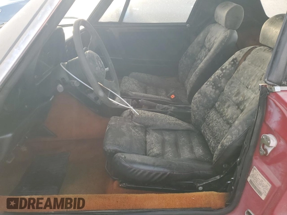 1990 Alfa Romeo Spider z VIN ZARBA12G6L6001683, wystawiony jako Copart lot #75611344 z przebiegiem 59 515 mil mil oraz Szkoda całkowita • Salvage title. Historia ofert i sprzedaży dostępna na DreamBid. Obrazek 7.