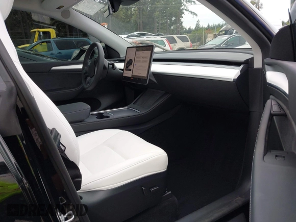 2023 Tesla Model Y Long Range z VIN 7SAYGDEE2PF885116, wystawiony jako IAAI lot #40091902 z przebiegiem 11 779 mil mil oraz . Historia ofert i sprzedaży dostępna na DreamBid. Obrazek 5.