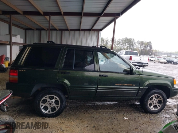1997 Jeep Grand Cherokee Limited with VIN 1J4GZ78Y5VC723429, listed as a IAAI auction lot 42012836 with 231,126 mi miles. Bid and sale history available at carsss.com. Image 13.