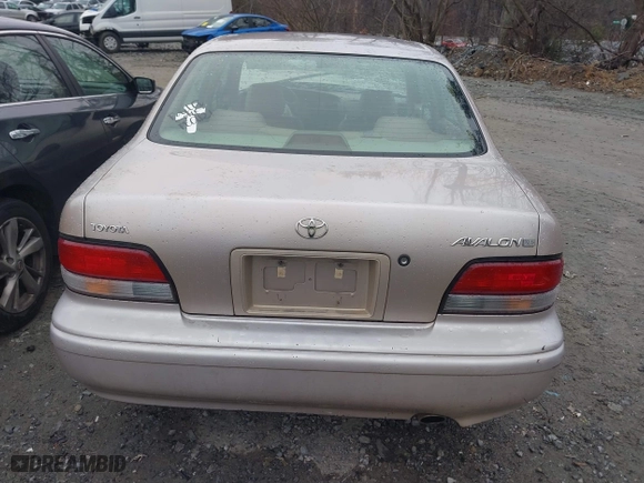 1997 Toyota Avalon XL with VIN 4T1BF12B1VU198756, listed as a IAAI auction lot 41613887 with 217,863 mi miles. Bid and sale history available at carsss.com. Image 16.