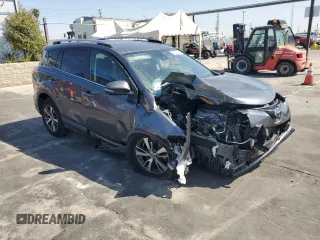 2018 Toyota RAV4 XLE with VIN JTMRFREVXJD251679, listed as a Copart auction lot 49454115 with 48,385 mi miles and Salvage Title. Bid and sale history available at DreamBid. Image 4.