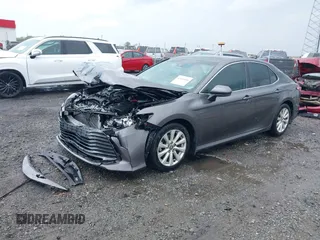 2020 Toyota Camry LE with VIN 4T1C11AK1LU328682, listed as a IAAI auction lot 41966816 with 172,334 mi miles and . Bid and sale history available at DreamBid. Image 2.