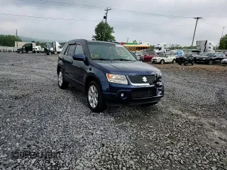 2012 Suzuki Grand Vitara Limited z VIN JS3TD0D77C4101382, wystawiony jako Copart lot #60017895 z przebiegiem 118 024 mil mil oraz Szkoda całkowita • Salvage title. Historia ofert i sprzedaży dostępna na DreamBid. Obrazek 14.
