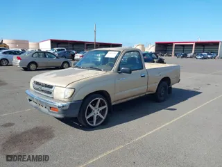 1998 Toyota Tacoma with VIN 4TANL42N7WZ006553, listed as a IAAI auction lot 41892709 with 130,140 mi miles. Bid and sale history available at carsss.com. Image 2.
