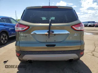 2013 Ford Escape SEL z VIN 1FMCU9H93DUD67848, wystawiony jako Copart lot #57221755 z przebiegiem 129 671 mil mil oraz Czysty tytuł • Clean title. Historia ofert i sprzedaży dostępna na DreamBid. Obrazek 6.