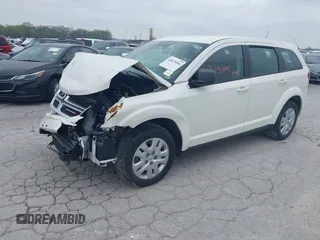 2014 Dodge Journey SE with VIN 3C4PDCAB7ET134454, listed as a IAAI auction lot 41966206 with 145,814 mi miles and . Bid and sale history available at DreamBid. Image 2.