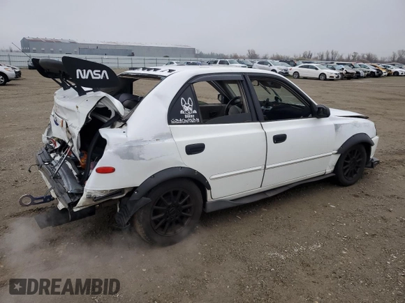 2002 Hyundai Accent GL with VIN KMHCG45C92U271388, listed as a Copart auction lot 85925124 with 98,390 mi miles and Salvage Title. Bid and sale history available at carsss.com. Image 3.