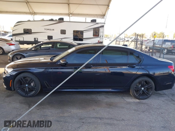 2019 BMW 7 Series 740i with VIN WBA7E2C58KB218419, listed as a IAAI auction lot 41831080 with 97,752 mi miles and . Bid and sale history available at DreamBid. Image 14.