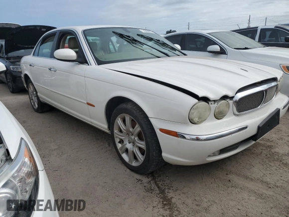 2004 Jaguar XJ with VIN SAJWA71C44SG34094, listed as a Copart auction lot 74969004 with 0 mi miles and Salvage Title. Bid and sale history available at carsss.com. Image 4.