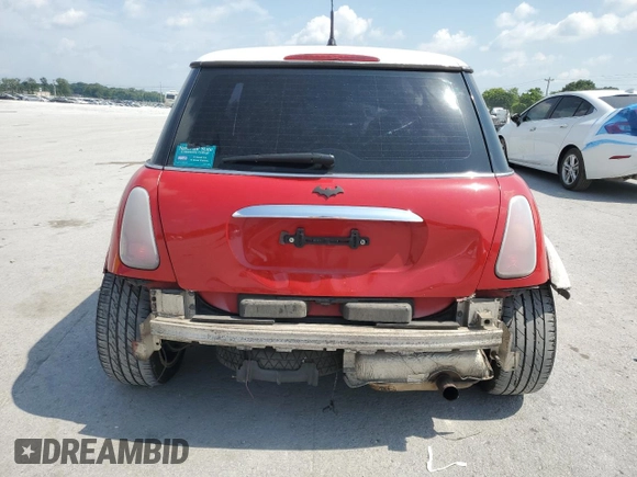 2004 MINI Hardtop with VIN WMWRC33444TC50103, listed as a Copart auction lot 63449615 with 144,467 mi miles and Salvage title. Bid and sale history available at DreamBid. Image 6.