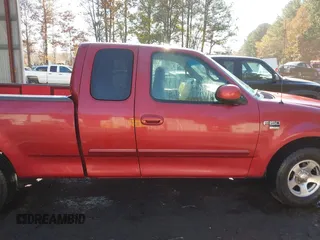 2000 Ford F-150 XL with VIN 1FTRX17L7YKA59717, listed as a IAAI auction lot 40887691 with 104,095 mi miles. Bid and sale history available at carsss.com. Image 13.