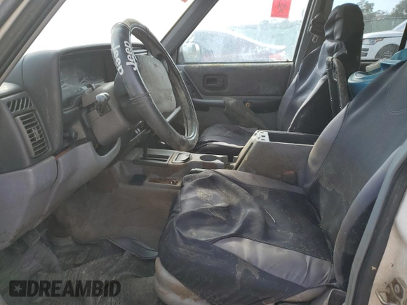 1998 Jeep Cherokee Sport with VIN 1J4FT68S8WL101900, listed as a Copart auction lot 86476444 with 0 mi miles and Salvage Title. Bid and sale history available at carsss.com. Image 7.