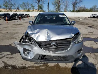 2016 Mazda CX-5 Touring with VIN JM3KE2CY8G0614335, listed as a Copart auction lot 52124465 with 218,320 mi miles and Salvage Title. Bid and sale history available at carsss.com. Image 5.