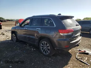 2017 Jeep Grand Cherokee Overland with VIN 1C4RJFCG0HC762612, listed as a Copart auction lot 57400095 with 122,702 mi miles and Salvage title. Bid and sale history available at DreamBid. Image 2.