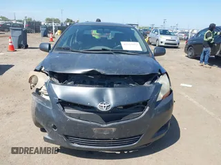 2009 Toyota Yaris with VIN JTDBT903891349784, listed as a IAAI auction lot 42135557 with 244,107 mi miles. Bid and sale history available at carsss.com. Image 6.