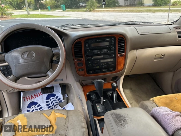1998 Lexus LX 470 z VIN JT6HT00W7W0008417, wystawiony jako Copart lot #79324334 z przebiegiem 183 911 mil mil oraz Czysty tytuł • Clean title. Historia ofert i sprzedaży dostępna na DreamBid. Obrazek 9.