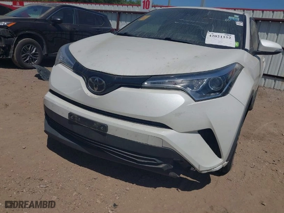 2019 Toyota C-HR XLE with VIN JTNKHMBX7K1023674, listed as a IAAI auction lot 42021152 with 106,450 mi miles. Bid and sale history available at carsss.com. Image 6.