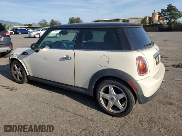 2010 MINI Hardtop with VIN WMWMF3C52ATZ65593, listed as a Copart auction lot 50107445 with 105,389 mi miles and Salvage title. Bid and sale history available at DreamBid. Image 2.