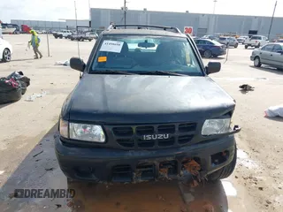 2001 Isuzu Rodeo S with VIN 4S2CK58W114363340, listed as a IAAI auction lot 41498698 with 185,408 mi miles and . Bid and sale history available at DreamBid. Image 12.