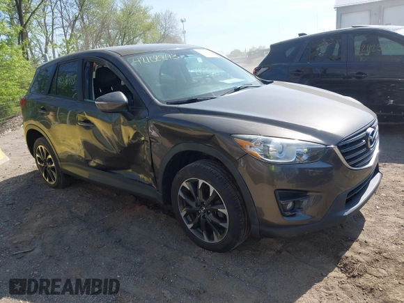 2016 Mazda CX-5 Grand Touring z VIN JM3KE4DY8G0846265, wystawiony jako IAAI lot #42102843 z przebiegiem 159 827 mil mil oraz . Historia ofert i sprzedaży dostępna na DreamBid. Obrazek 6.