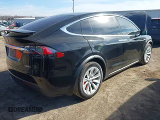 2018 Tesla Model X 75D with VIN 5YJXCDE44JF091690, listed as a IAAI auction lot 41585617 with 128,826 mi miles and . Bid and sale history available at DreamBid. Image 4.