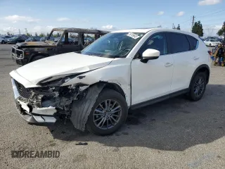 2020 Mazda CX-5 Touring z VIN JM3KFACM1L0867172, wystawiony jako Copart lot #56749645 z przebiegiem 69 311 mil mil oraz Szkoda całkowita • Salvage title. Historia ofert i sprzedaży dostępna na DreamBid. Obrazek 1.
