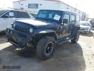2013 Jeep Wrangler Unlimited Sport with VIN 1C4BJWDG9DL569109, listed as a IAAI auction lot 41207715 with 120,800 mi miles. Bid and sale history available at carsss.com. Image 2.