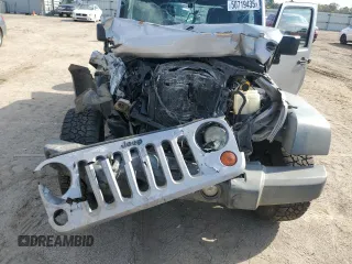 2013 Jeep Wrangler Unlimited Sport z VIN 1C4BJWDG7DL597491, wystawiony jako Copart lot #50719435 z przebiegiem Nie podano mil oraz Szkoda całkowita • Salvage title. Historia ofert i sprzedaży dostępna na DreamBid. Obrazek 13.