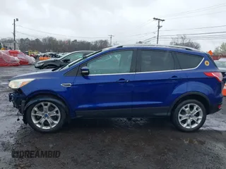 2014 Ford Escape Titanium with VIN 1FMCU9J99EUA46103, listed as a IAAI auction lot 42018097 with 169,878 mi miles and . Bid and sale history available at DreamBid. Image 18.