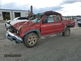 2003 Toyota Tacoma PreRunner z VIN 5TEGN92N03Z232888, wystawiony jako Copart lot #56922295 z przebiegiem 281 137 mil mil oraz Szkoda całkowita • Salvage title. Historia ofert i sprzedaży dostępna na DreamBid. Obrazek 1.