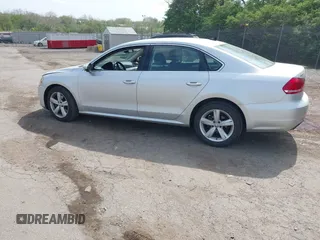 2012 Volkswagen Passat SE with VIN 1VWBP7A32CC101143, listed as a IAAI auction lot 42124955 with 64,843 mi miles. Bid and sale history available at carsss.com. Image 3.