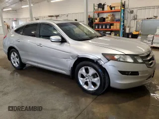 2010 Honda Crosstour EX-L z VIN 5J6TF1H50AL010880, wystawiony jako Copart lot #55805665 z przebiegiem 116 323 mil mil oraz Szkody całkowita. Historia ofert i sprzedaży dostępna na DreamBid. Obrazek 4.