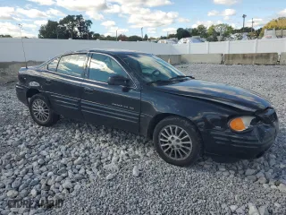1999 Pontiac Grand Am SE2 with VIN 1G2NE52E2XM732523, listed as a Copart auction lot 75420684 with 124,110 mi miles and Salvage Title. Bid and sale history available at carsss.com. Image 4.