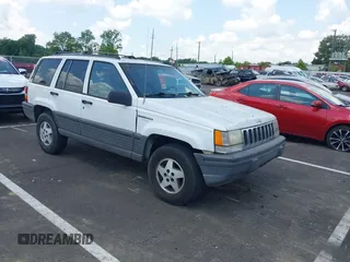 1995 Jeep Grand Cherokee Laredo z VIN 1J4FX58S0SC613756, wystawiony jako IAAI lot #42571785 z przebiegiem 122 759 mil mil oraz . Historia ofert i sprzedaży dostępna na DreamBid. Obrazek 1.
