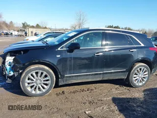 2019 Cadillac XT5 Premium Luxury AWD z VIN 1GYKNFRS1KZ250468, wystawiony jako IAAI lot #41764152 z przebiegiem 107 918 mil mil oraz . Historia ofert i sprzedaży dostępna na DreamBid. Obrazek 14.