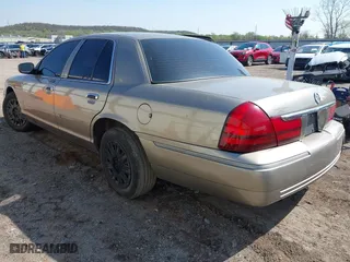 2004 Mercury Grand Marquis GS with VIN 2MEFM74W94X674014, listed as a IAAI auction lot 41973693 with 163,865 mi miles. Bid and sale history available at carsss.com. Image 3.