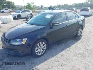2014 Volkswagen Jetta SE with VIN 3VWD07AJ6EM413088, listed as a IAAI auction lot 42541755 with 163,278 mi miles and . Bid and sale history available at DreamBid. Image 2.