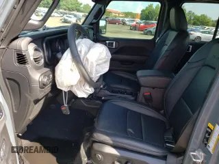 2024 Jeep Wrangler Sahara with VIN 1C4PJXEGXRW269062, listed as a Copart auction lot 64576895 with 2,159 mi miles and Salvage title. Bid and sale history available at DreamBid. Image 7.