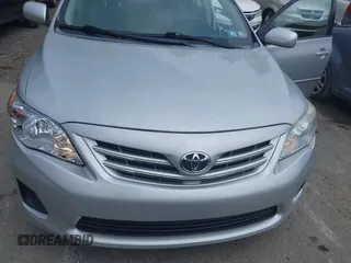 2013 Toyota Corolla L with VIN 2T1BU4EEXDC052854, listed as a IAAI auction lot 42230118 with 156,120 mi miles and . Bid and sale history available at DreamBid. Image 21.