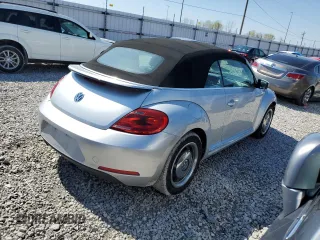 2015 Volkswagen Beetle 1.8T with VIN 3VW517AT8FM810709, listed as a Copart auction lot 48065314 with 61,924 mi miles and Salvage Title. Bid and sale history available at DreamBid. Image 3.