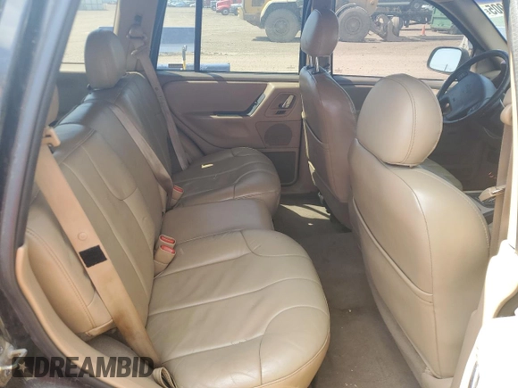 2000 Jeep Grand Cherokee Laredo z VIN 1J4GW48N0YC210235, wystawiony jako Copart lot #60558905 z przebiegiem 131 108 mil mil oraz Szkoda całkowita • Salvage title. Historia ofert i sprzedaży dostępna na DreamBid. Obrazek 11.
