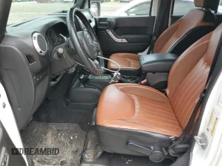 2014 Jeep Wrangler Unlimited Rubicon with VIN 1C4HJWFG4EL114743, listed as a Copart auction lot 61397575 with 110,222 mi miles and Salvage title. Bid and sale history available at DreamBid. Image 7.