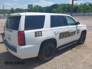 2020 Chevrolet Tahoe Commercial with VIN 1GNLCDECXLR154849, listed as a IAAI auction lot 42050778 with 124,771 mi miles and . Bid and sale history available at DreamBid. Image 4.