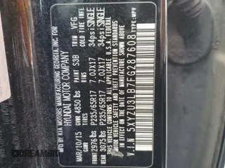2015 Hyundai Santa Fe z VIN 5XYZU3LB7FG287608, wystawiony jako Copart lot #54870005 z przebiegiem 245 483 mil mil oraz Szkoda całkowita • Salvage title. Historia ofert i sprzedaży dostępna na DreamBid. Obrazek 14.