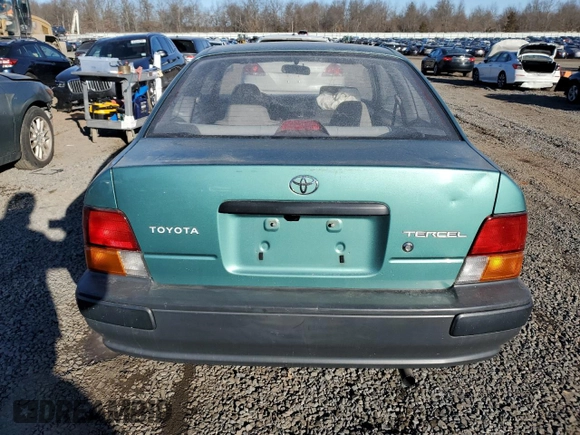 1996 Toyota Tercel DX z VIN JT2AC52L6T0170537, wystawiony jako Copart lot #42576525 z przebiegiem 66 926 mil mil oraz Szkoda całkowita • Salvage title. Historia ofert i sprzedaży dostępna na DreamBid. Obrazek 6.