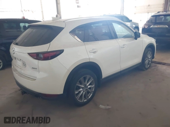 2019 Mazda CX-5 Grand Touring with VIN JM3KFBDM5K0520852, listed as a IAAI auction lot 42686818 with 36,800 mi miles and . Bid and sale history available at DreamBid. Image 4.