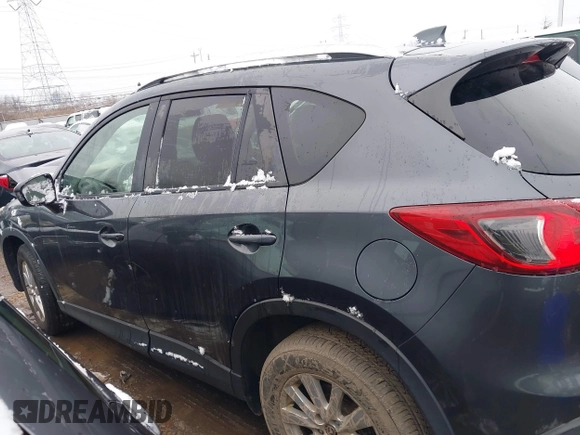 2014 Mazda CX-5 Touring with VIN JM3KE2CY2E0407453, listed as a IAAI auction lot 41564916 with 104,852 mi miles. Bid and sale history available at carsss.com. Image 13.