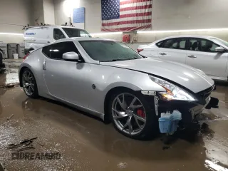 2014 Nissan 370Z Nismo with VIN JN1AZ4EH2EM636132, listed as a Copart auction lot 87218744 with 39,254 mi miles and Salvage Title. Bid and sale history available at DreamBid. Image 4.